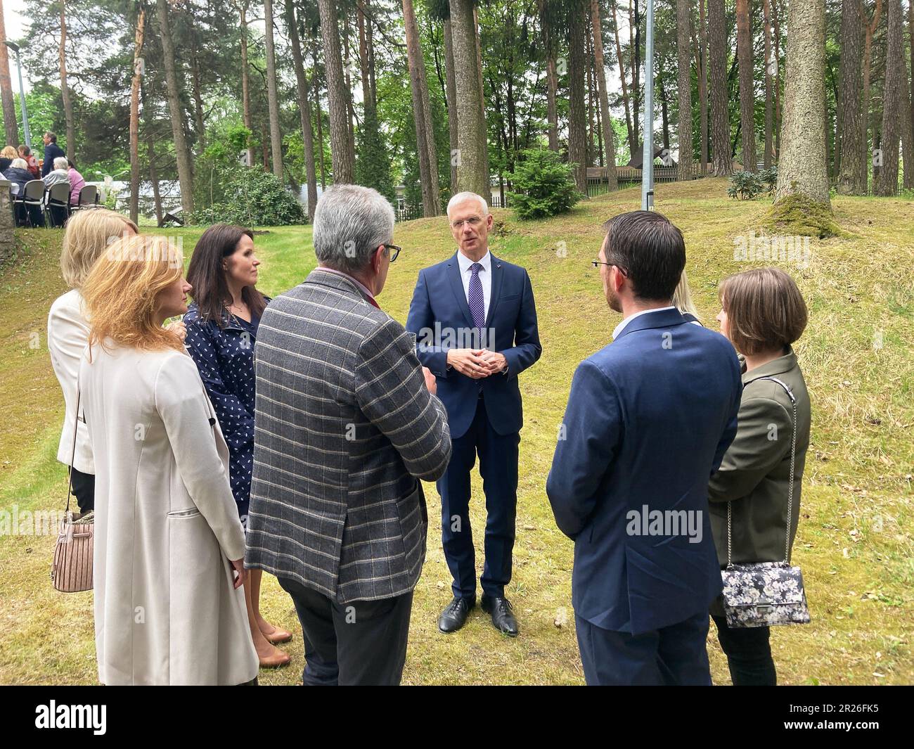 Riga, Latvia. 17th May, 2023. Krisjanis Karins (M), Prime Minister of Latvia, talking with other former graduates of the Latvian High School in Münster. Credit: Alexander Welscher/dpa/Alamy Live News Stock Photo