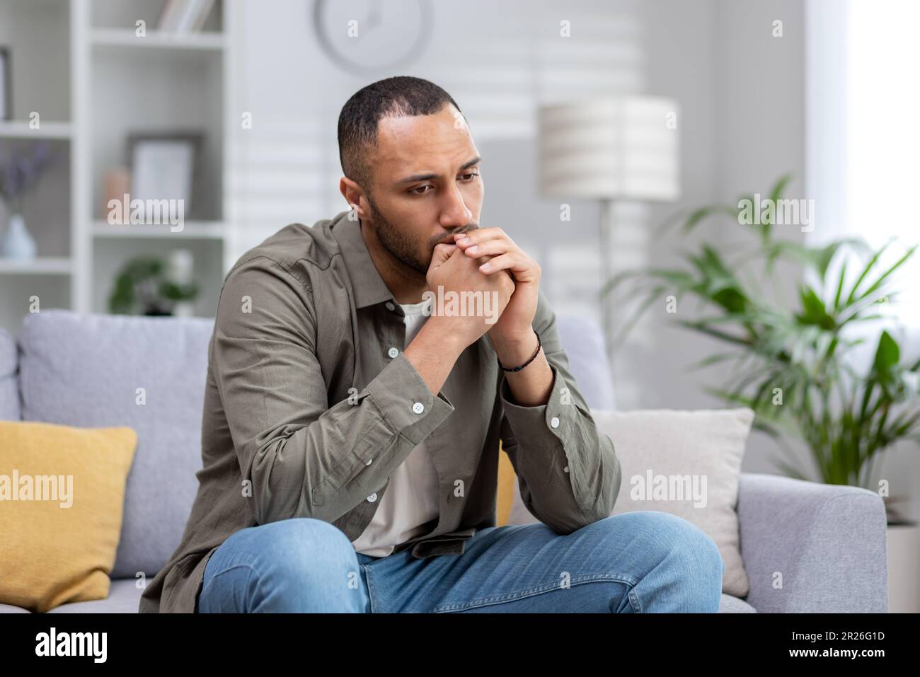 Arab man sitting in sofa hi-res stock photography and images - Alamy