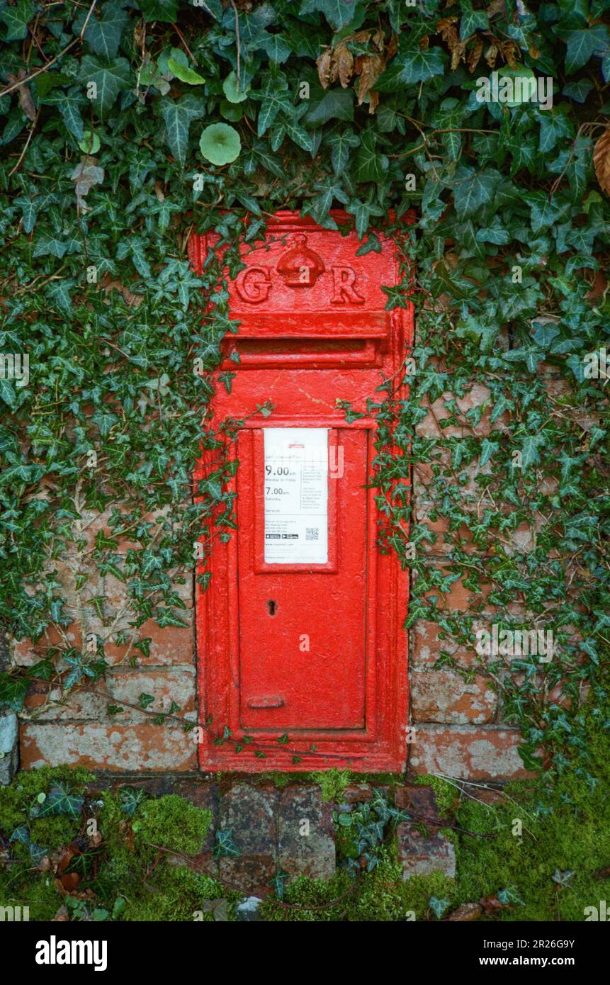 Red Post box, High Bickington, Devon, England, United Kingdom, Stock Photo