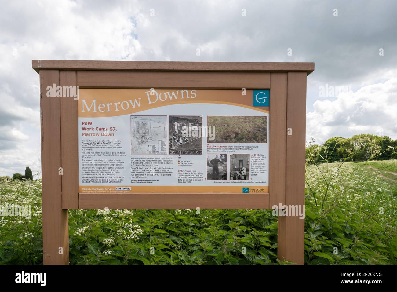 Information board at Merrow Downs, Guildford, Surrey, England, UK, explaining the history of the Prisoner of War Camp that was situated there Stock Photo