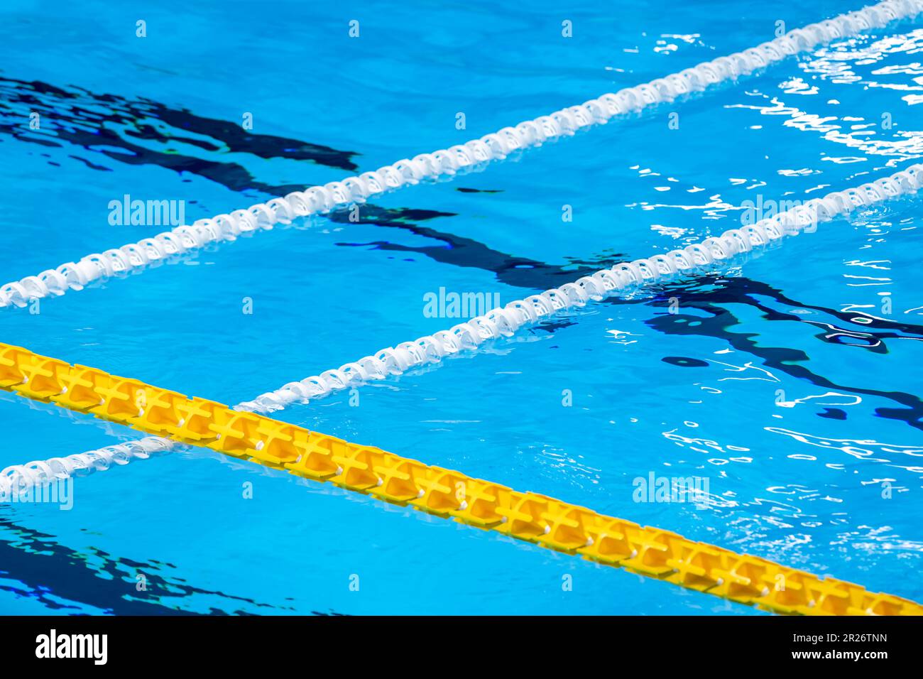 The view of an empty public swimming pool indoors. Lanes of a competition swimming pool. Horizontal sport theme poster, greeting cards, headers, websi Stock Photo
