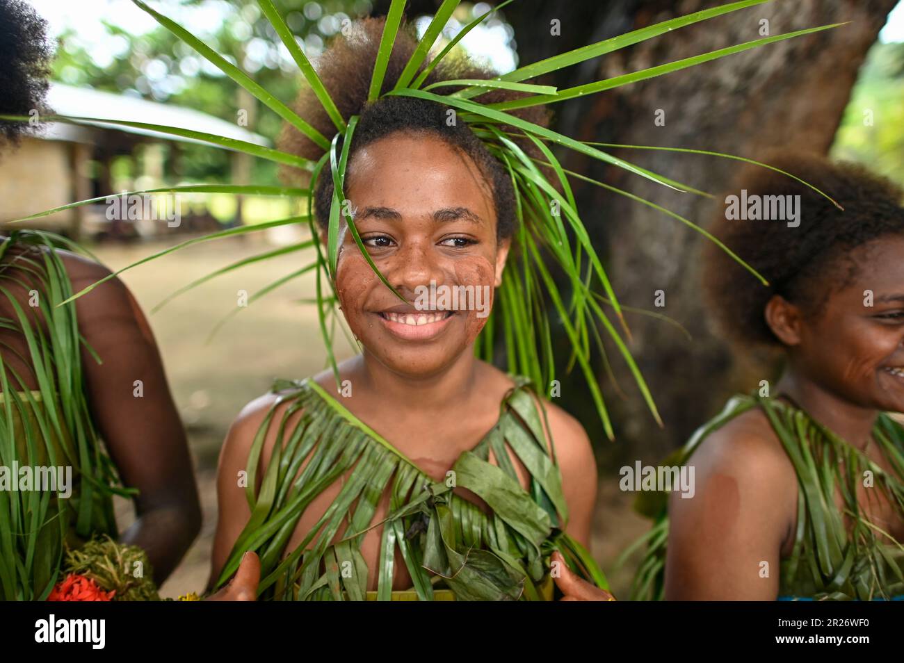 Indigenous teens of the Solomon Islands dressed in traditional outfits