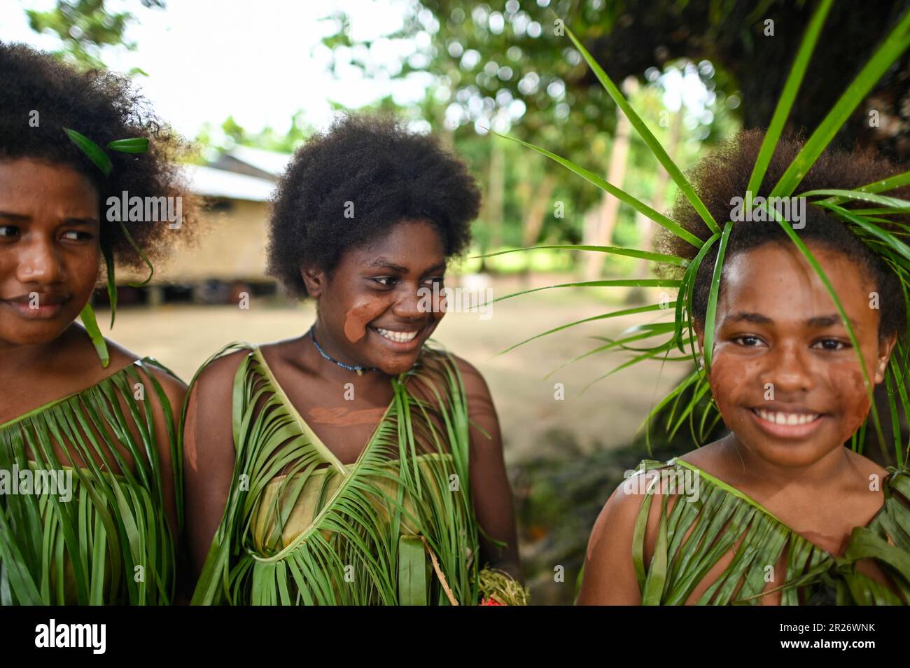 Indigenous teens of the Solomon Islands dressed in traditional outfits. Stock Photo