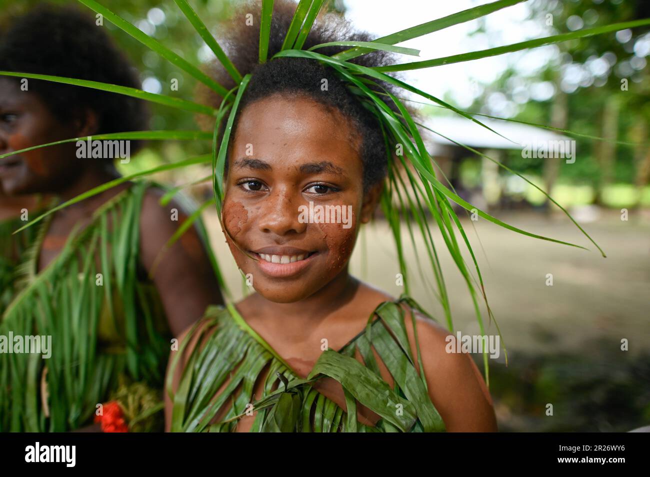 Indigenous teens of the Solomon Islands dressed in traditional outfits