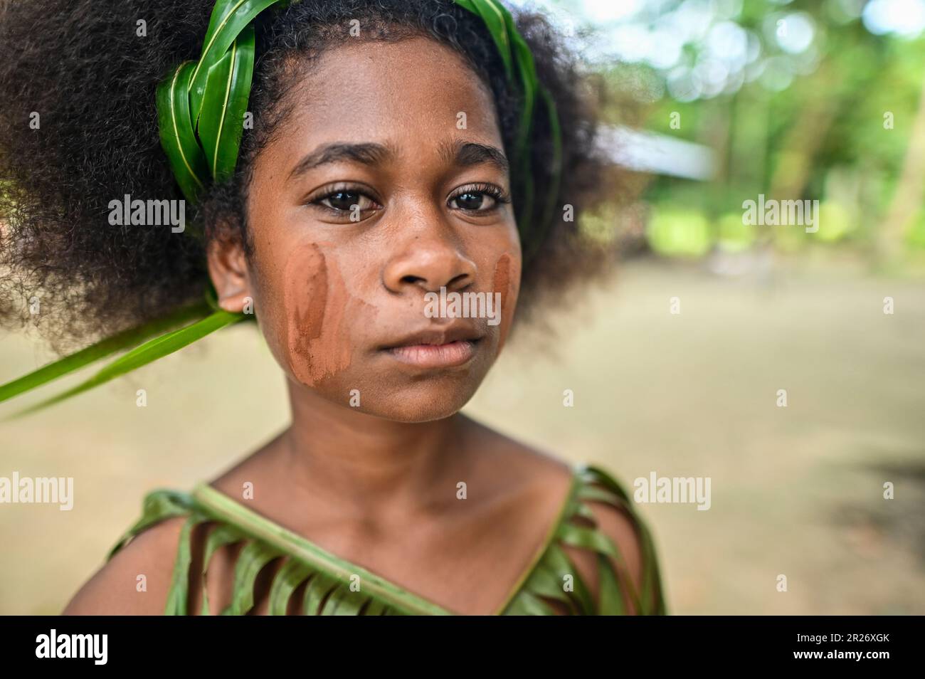 Indigenous teens of the Solomon Islands dressed in traditional outfits. Stock Photo