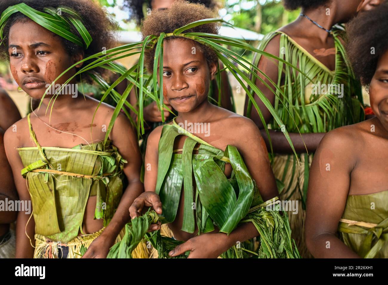 Indigenous teens of the Solomon Islands dressed in traditional outfits