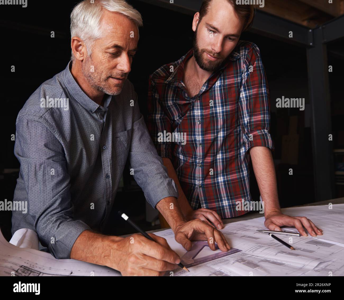 Turning his vision into reality. An architect drawing up plans Stock