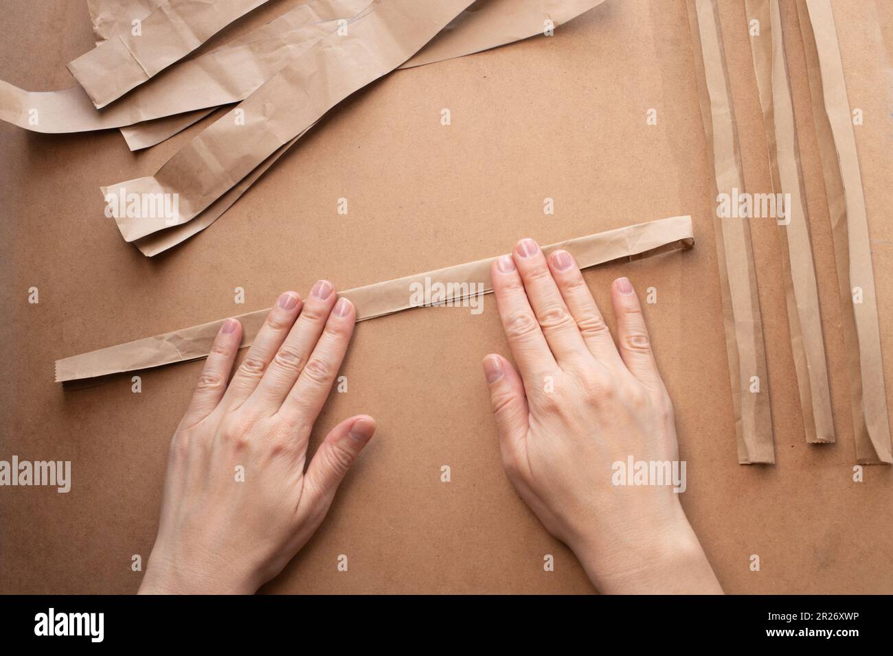 Hands Fold A Strip Of Paper In Half Lengthwise Stock Photo Alamy hands-fold-a-strip-of-paper-in-half-lengthwise-stock-photo-alamy