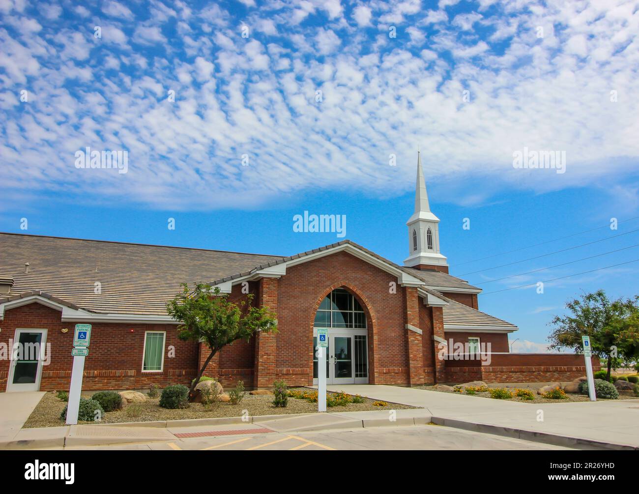 Local Church Entrance With White Steeple Stock Photo