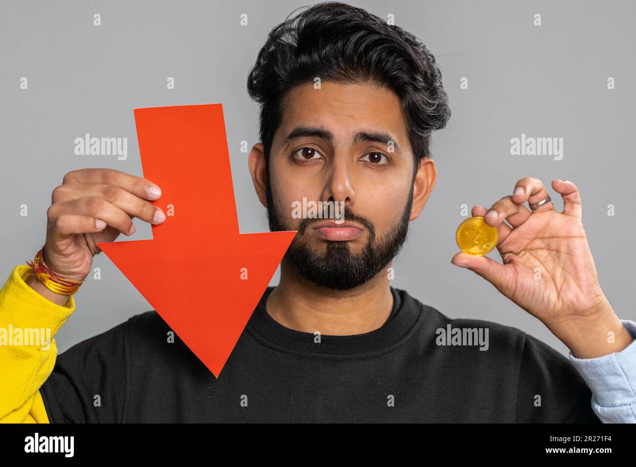 Upset indian man showing red arrow pointing down, downgrade, unsuccessful  business, fall of cryptocurrency stock market investment, mining bitcoins  BTC money exchange rate, bankruptcy fail. Hindu guy Stock Photo - Alamy