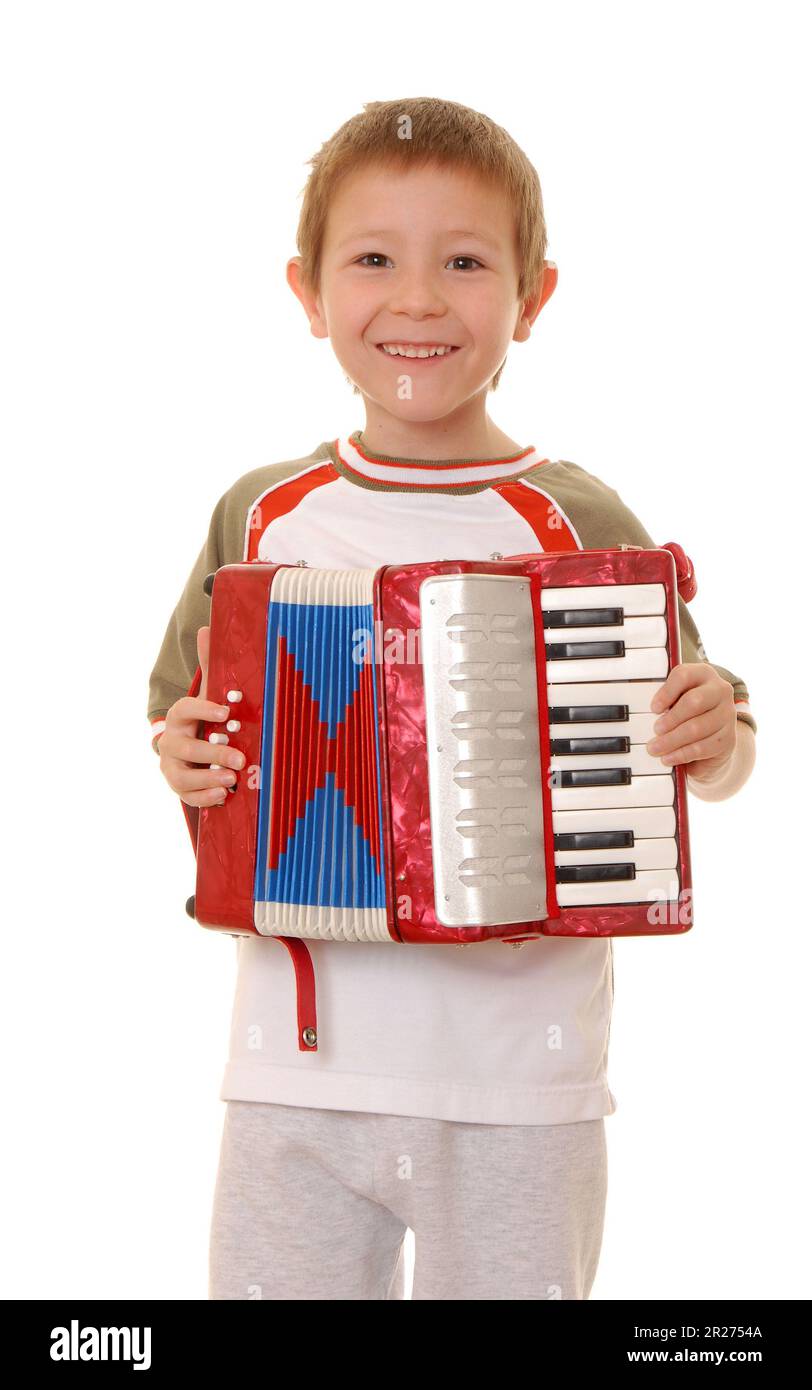 Isolated young boy playing a diatonic accordion Stock Photo Alamy