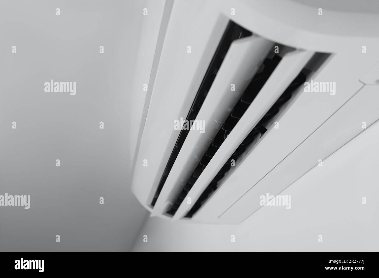 Modern air conditioner on white wall indoors, closeup Stock Photo - Alamy