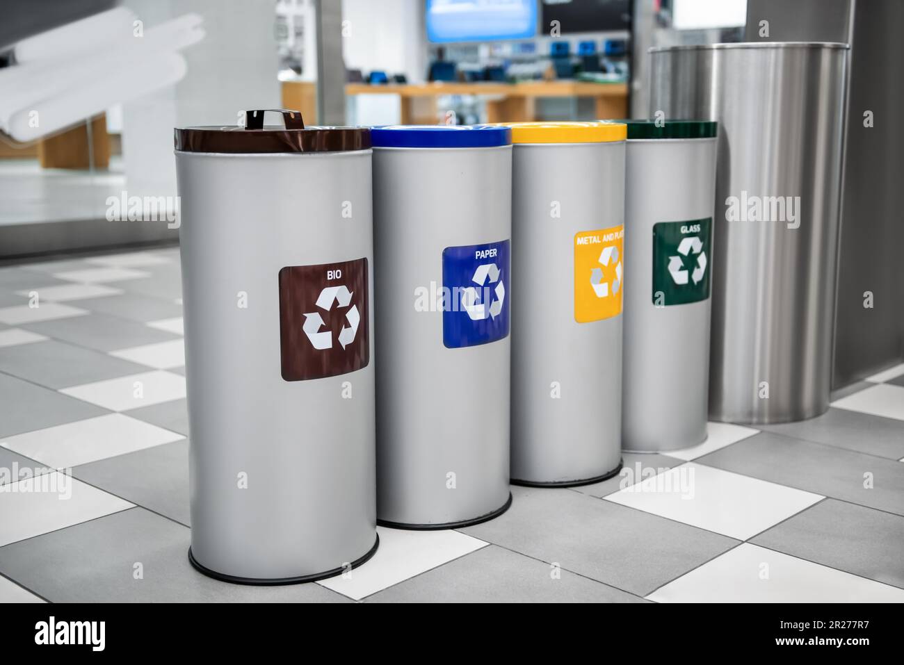 Different recycling bins for trash in shopping mall Stock Photo Alamy