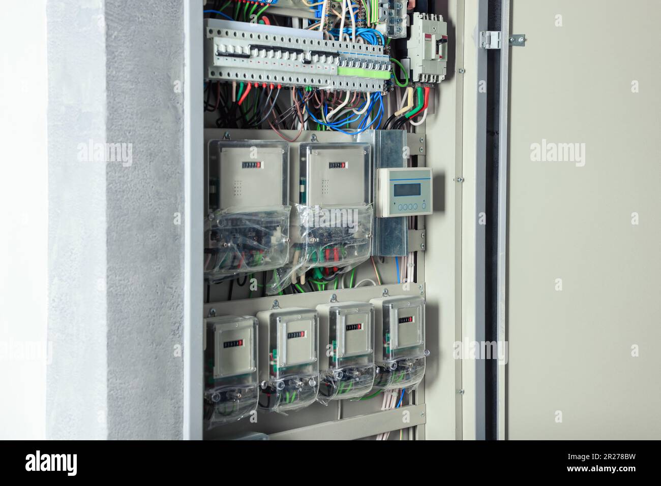 Open electrical fuse box with many electric meters Stock Photo Alamy