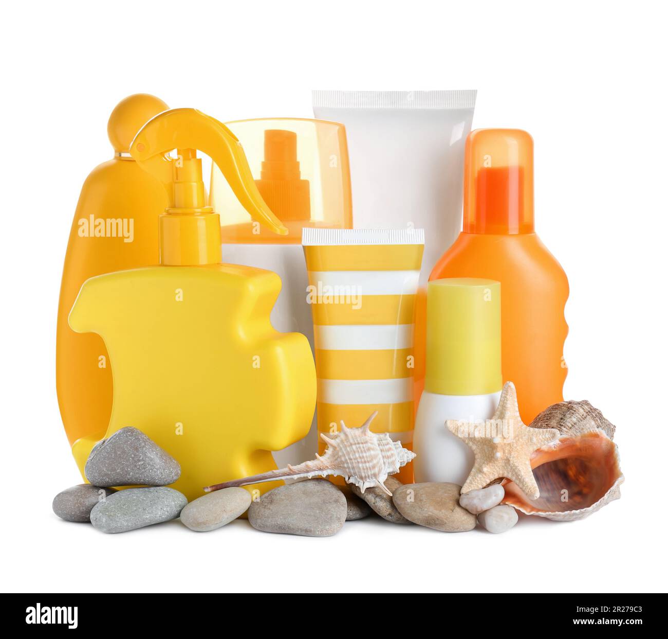Different suntan products, seashells, starfish and stones on white