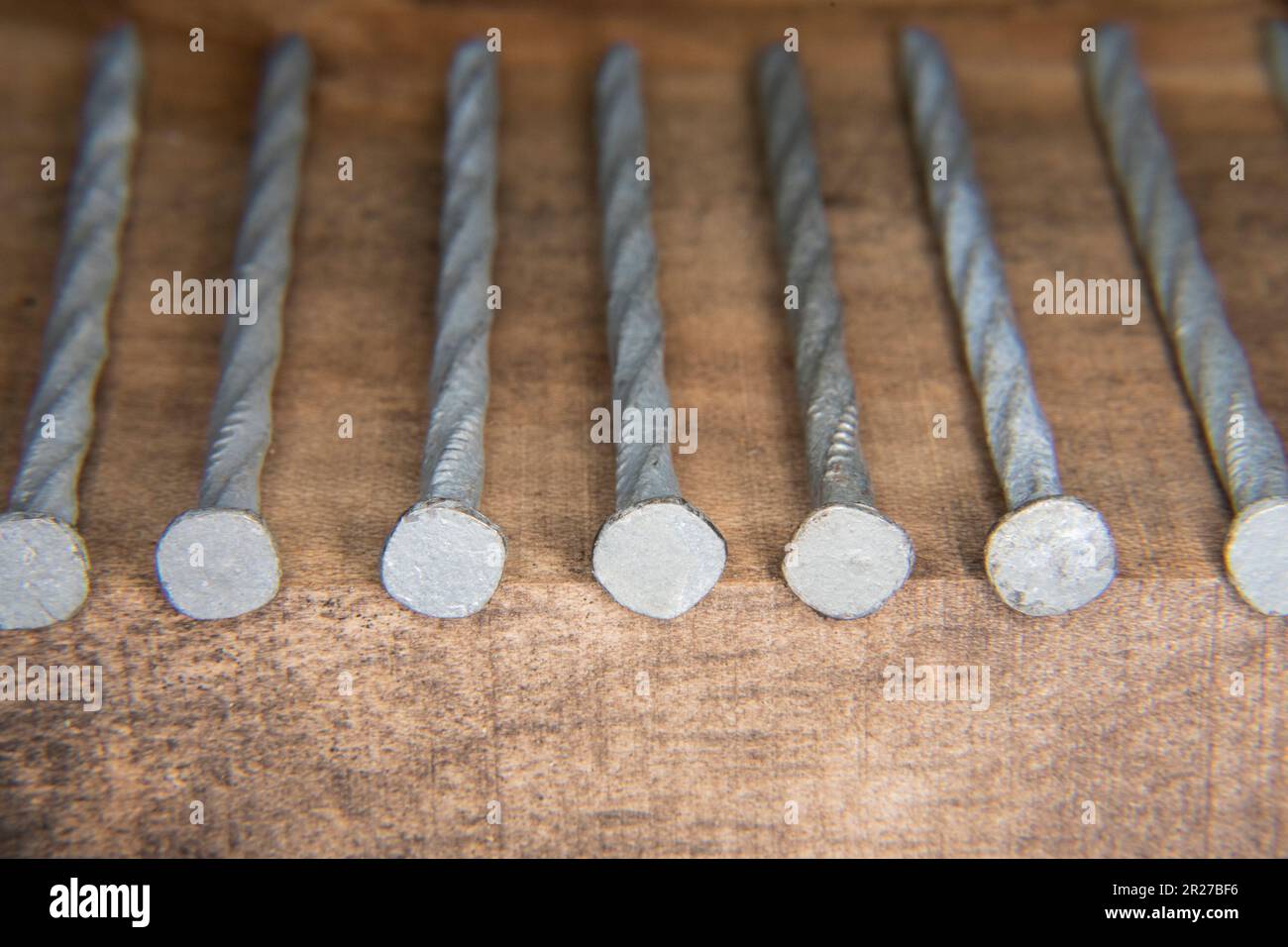long grey gray galvanized nails spiral 20d 20 penny nails used for flooring and decking Stock