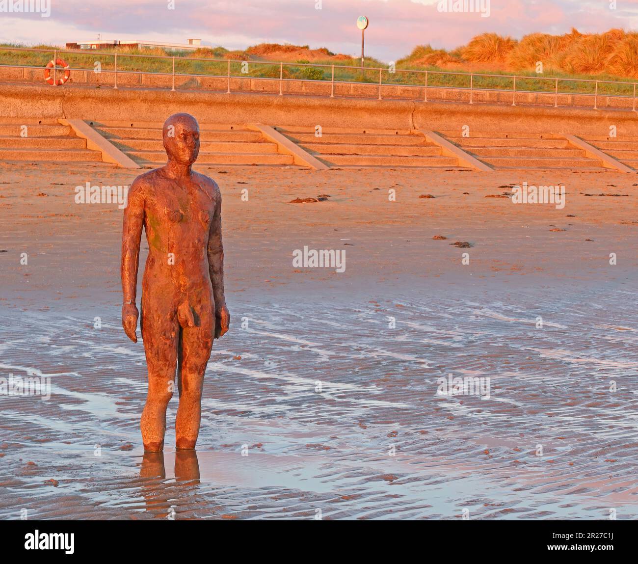 Antony Gormley, Another Place artwork sculpture, cast iron figures, located between Waterloo and Blundellsands, Merseyside, UK, Stock Photo