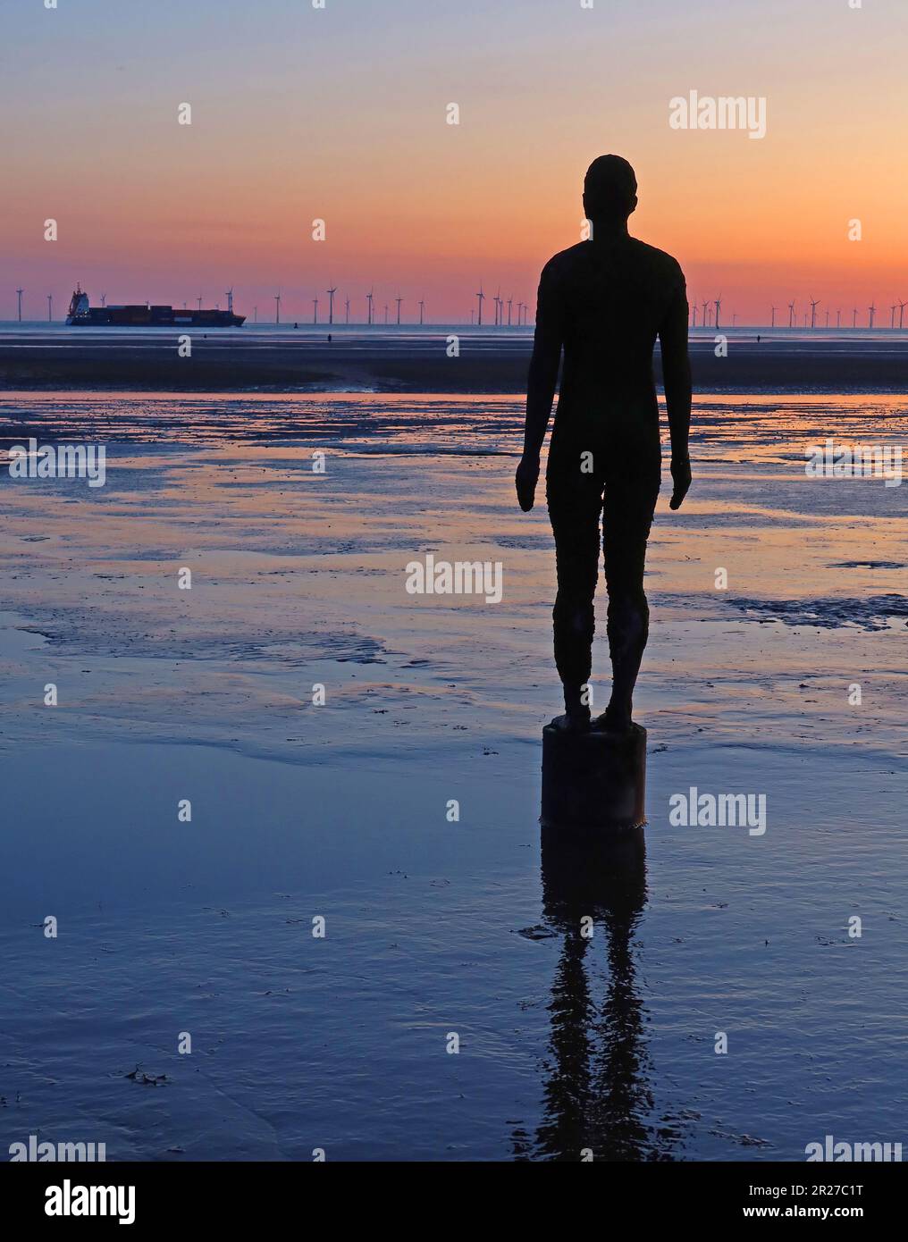 Antony Gormley, Another Place artwork sculpture, cast iron figures, located between Waterloo and Blundellsands, Merseyside, UK, Stock Photo