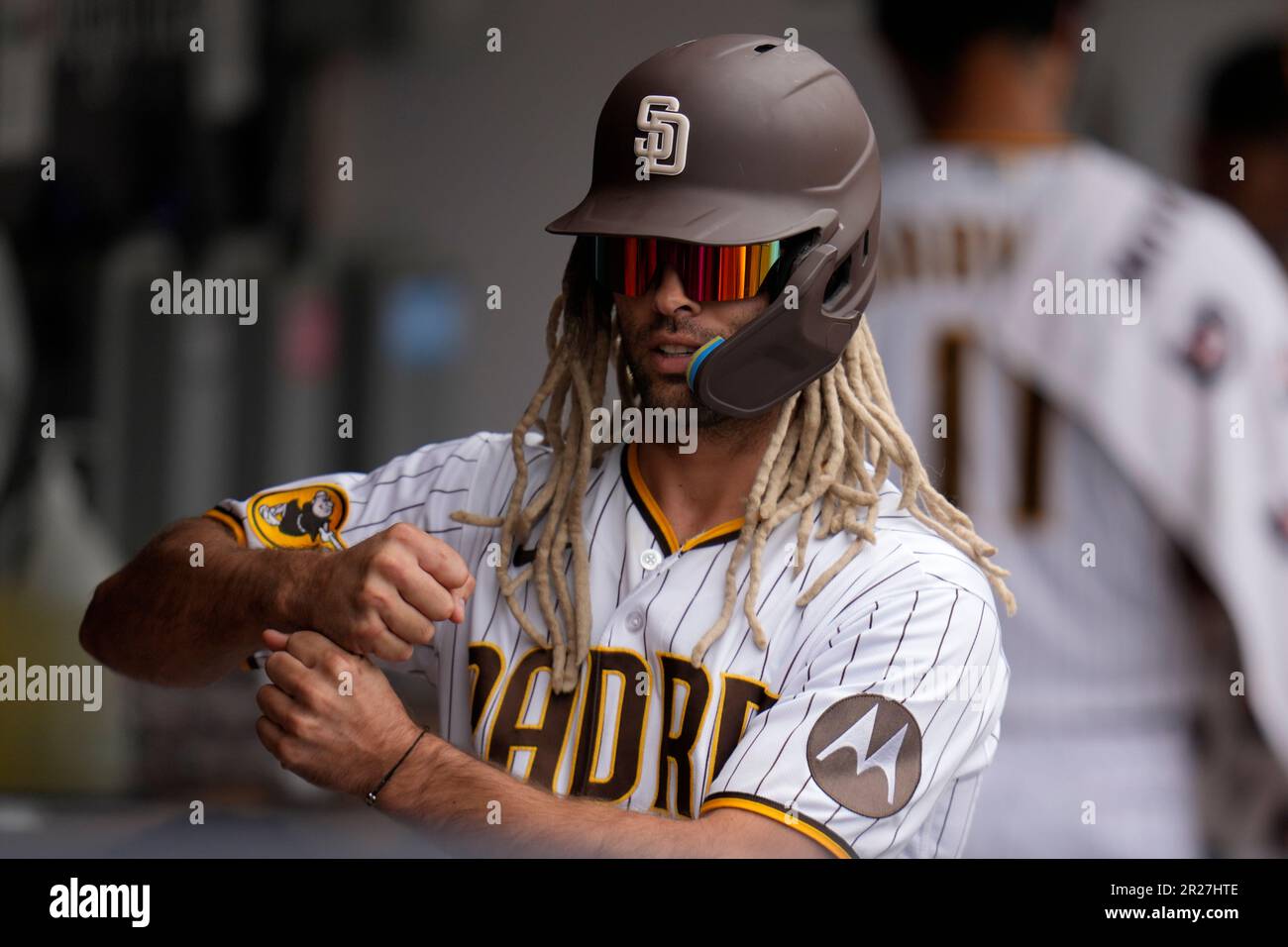 San Diego Padres pitcher Nick Martinez wears a fake hair clip to