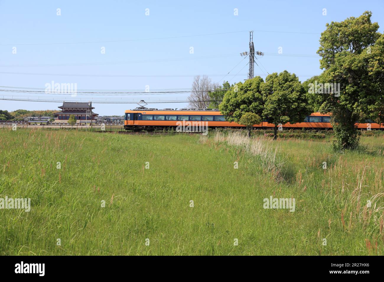 Kintetsu espress trains running through Heizeikyu palace site Stock Photo