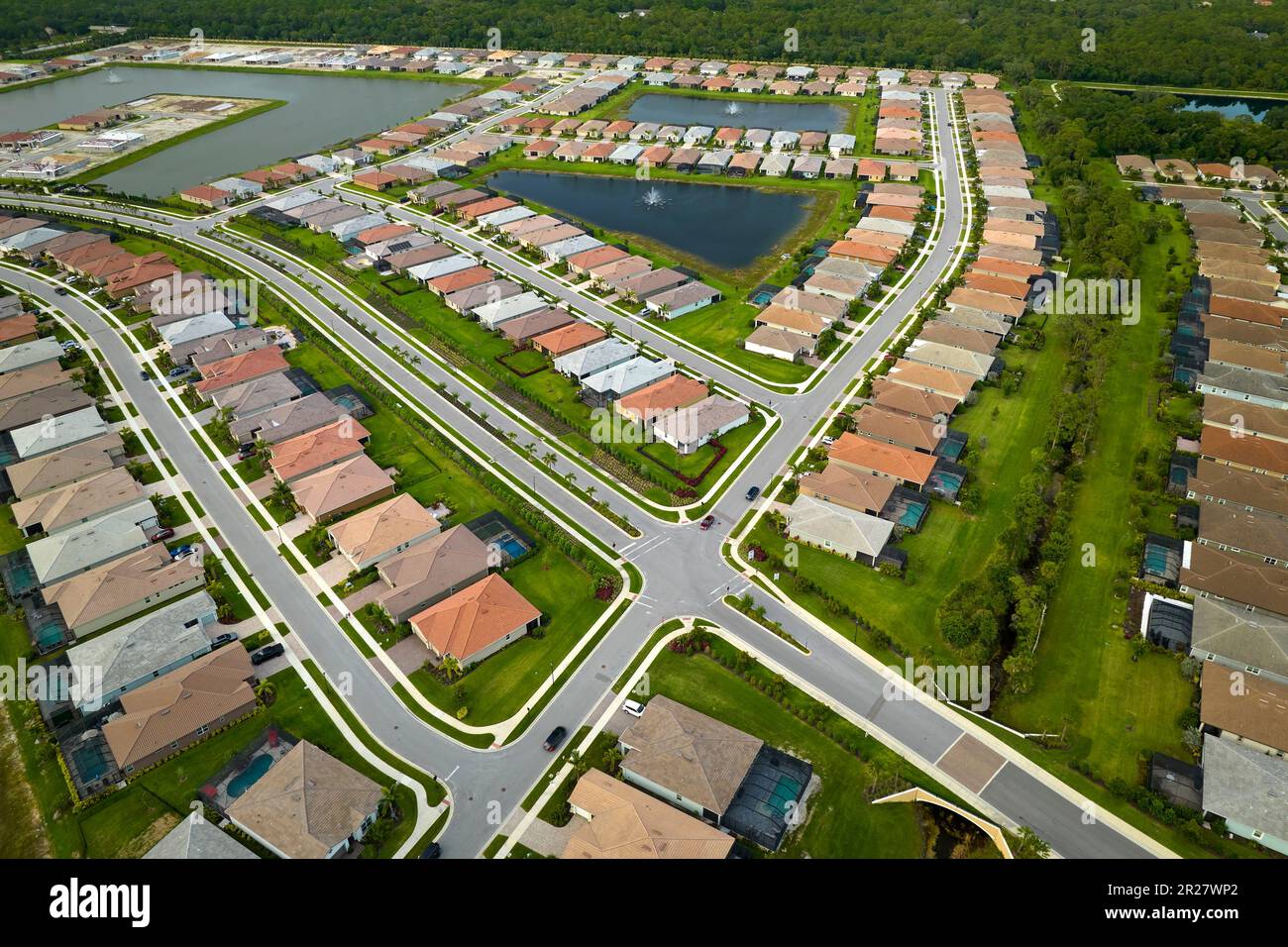 Aerial view of tightly located family houses in Florida closed suburban