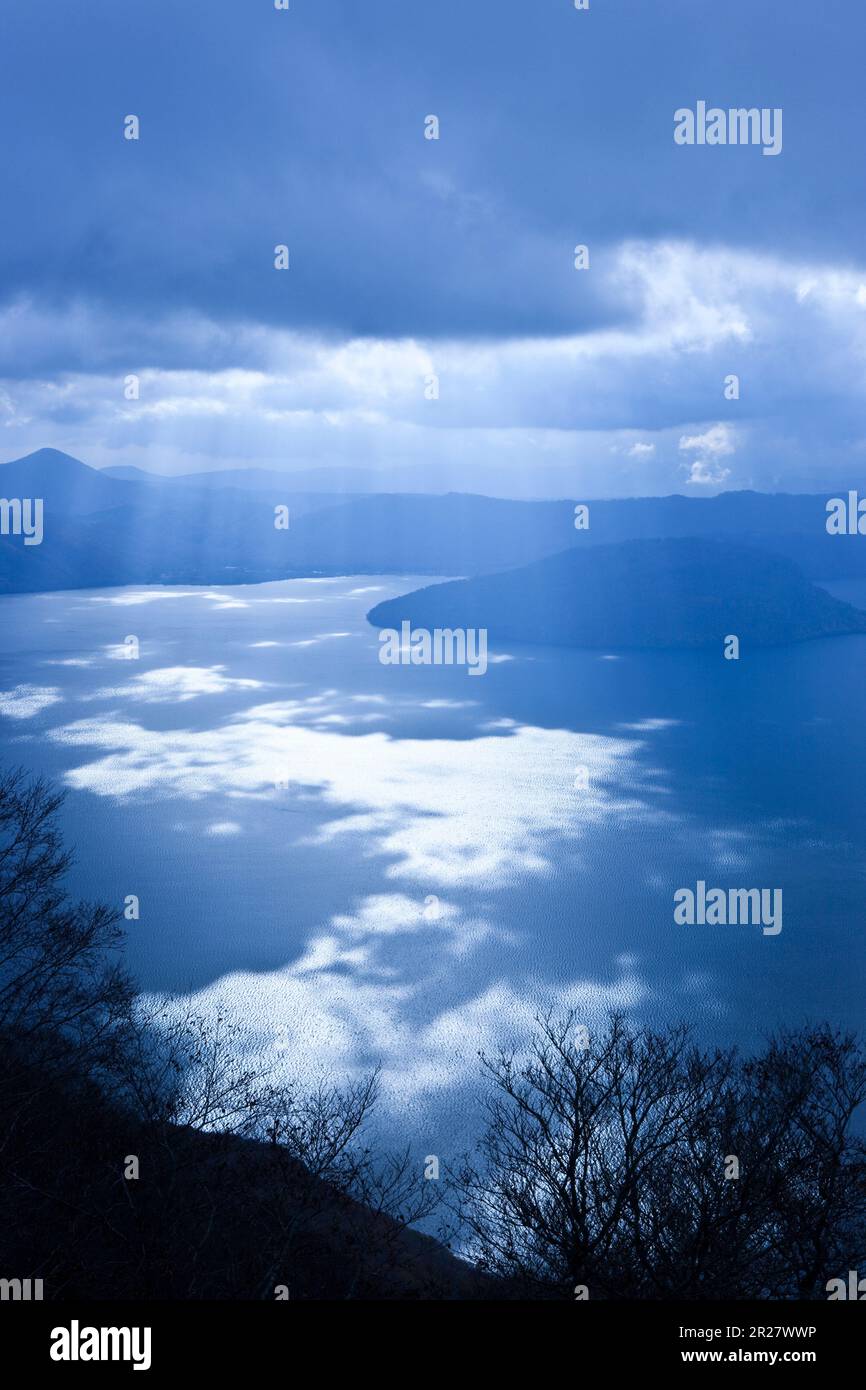 View of Lake Towada and beam of light from Mt. Ohanabeyama viewpoint Stock Photo