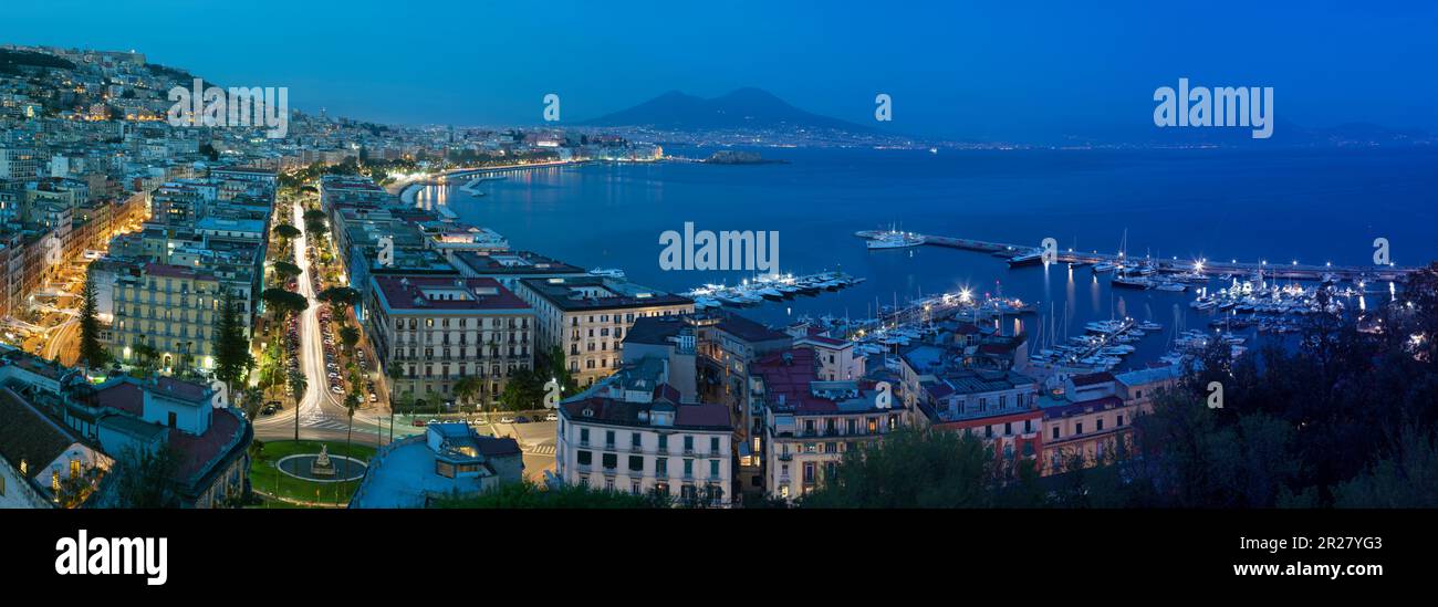 The panorama of Naples in the evening dusk. Stock Photo