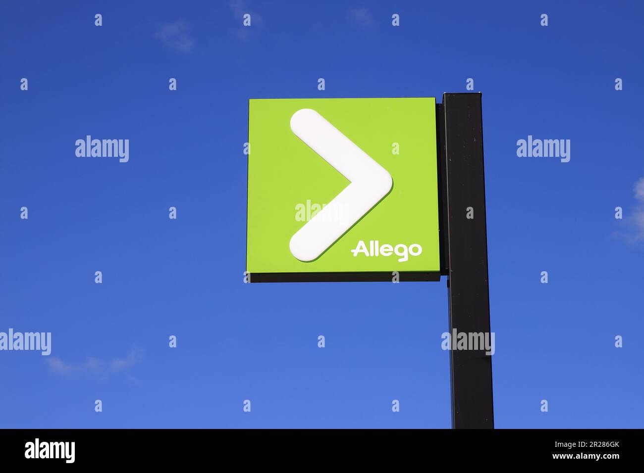 Sodertalje, Sweden - May 6, 2023: Close-up view of the pan-European EV charging network Allego sign at a charching station. Stock Photo