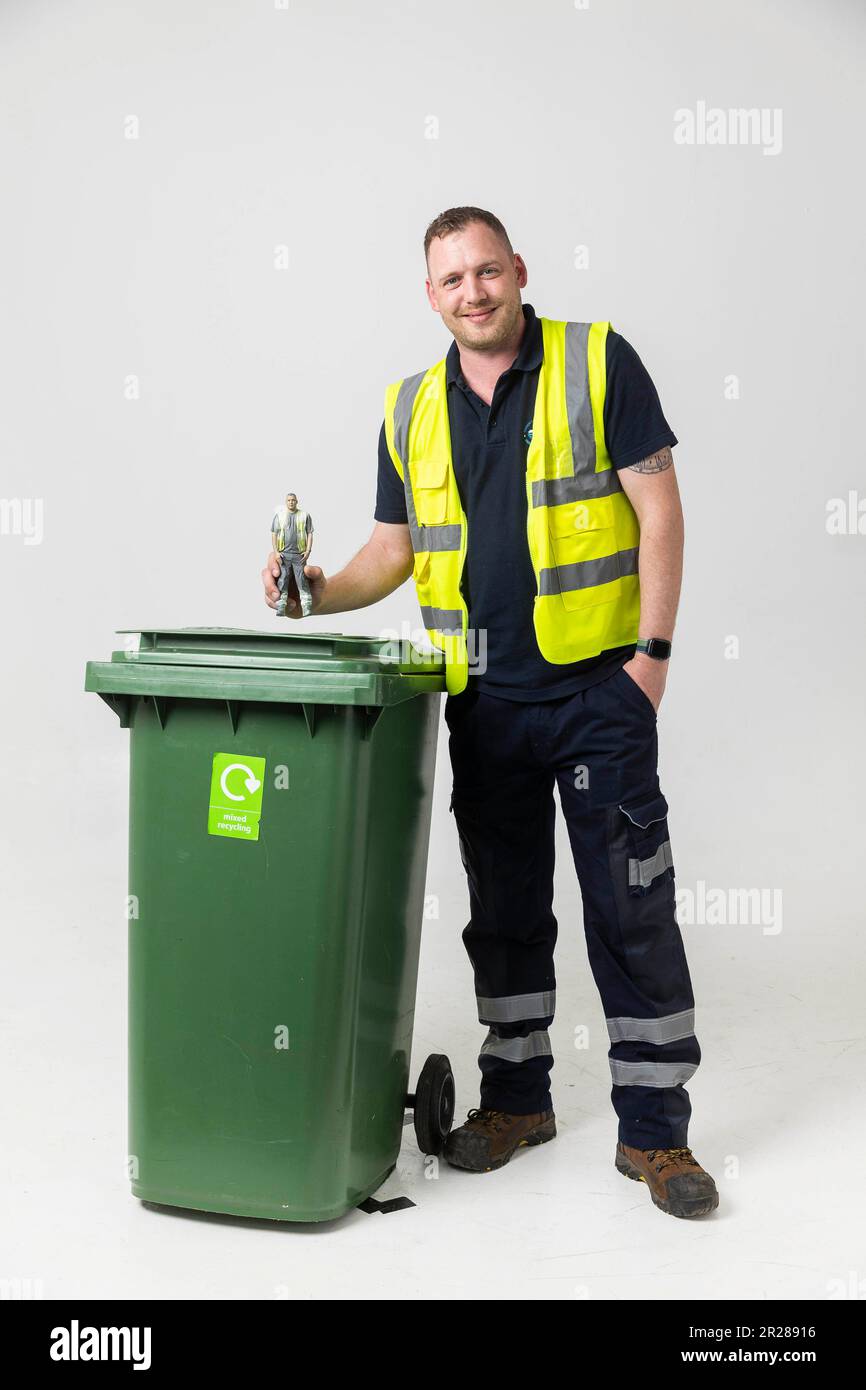 EDITORIAL USE ONLY Refuse collector Richard Brace unveils the 'everyday action hero' figure based on him, created by the UK's biggest union UNISON to raise awareness of the role local council workers play in providing essential services. Issue date: Thursday May 18, 2023. Stock Photo