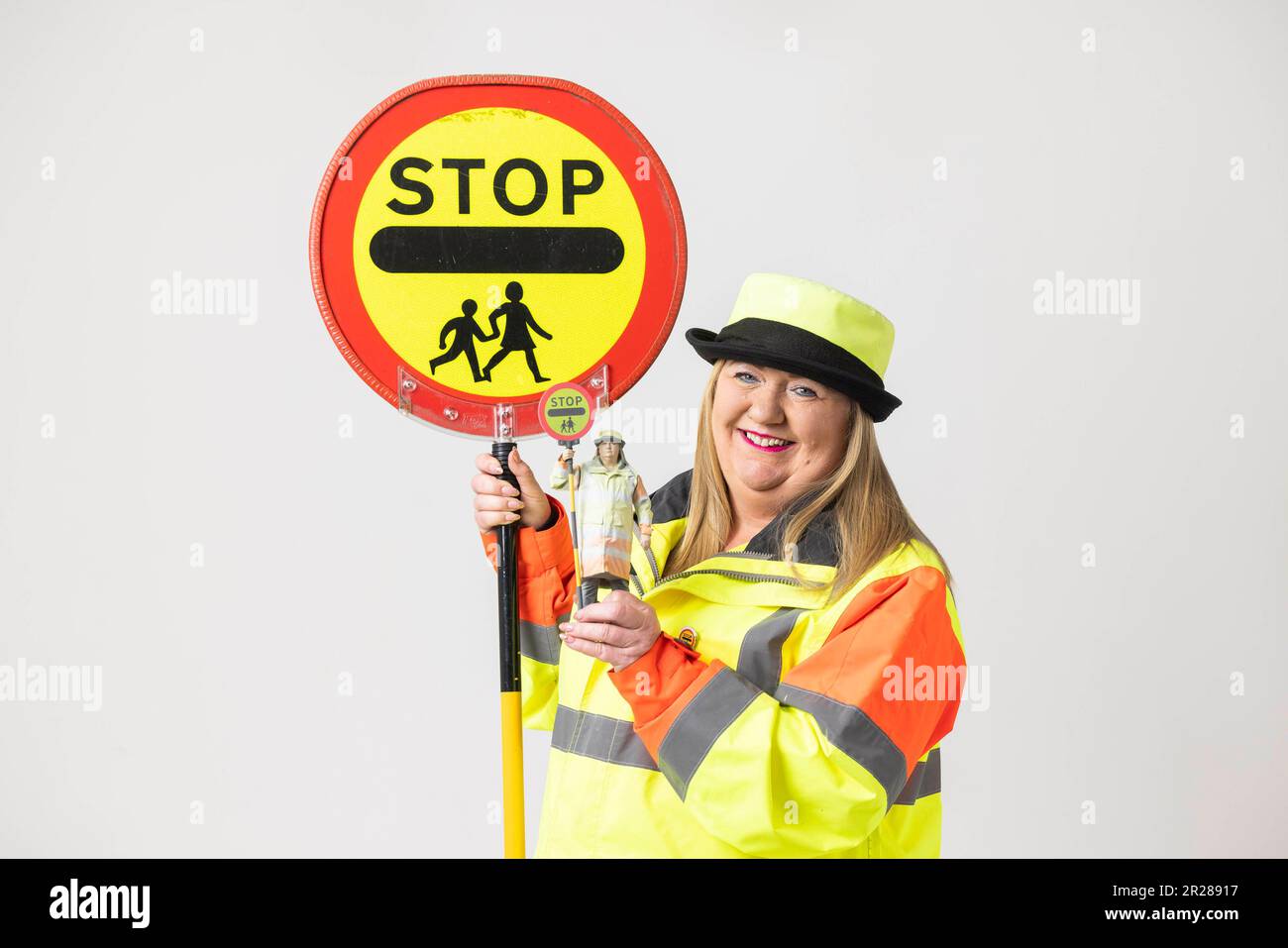 EDITORIAL USE ONLY Lollipop lady Sandy Cox unveils the 'everyday action hero' figure based on herself, created by the UK's biggest union UNISON to raise awareness of the role local council workers play in providing essential services. Issue date: Thursday May 18, 2023. Stock Photo