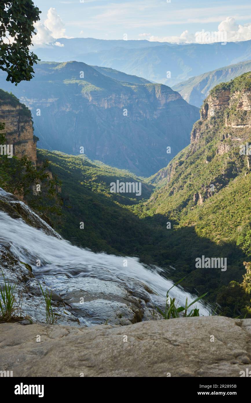 Stunning mountain scenery, view from the top of the Manchego waterfall, which falls into the Chicamocha canyon, in Aratoca, Santander, Colombia. Stock Photo