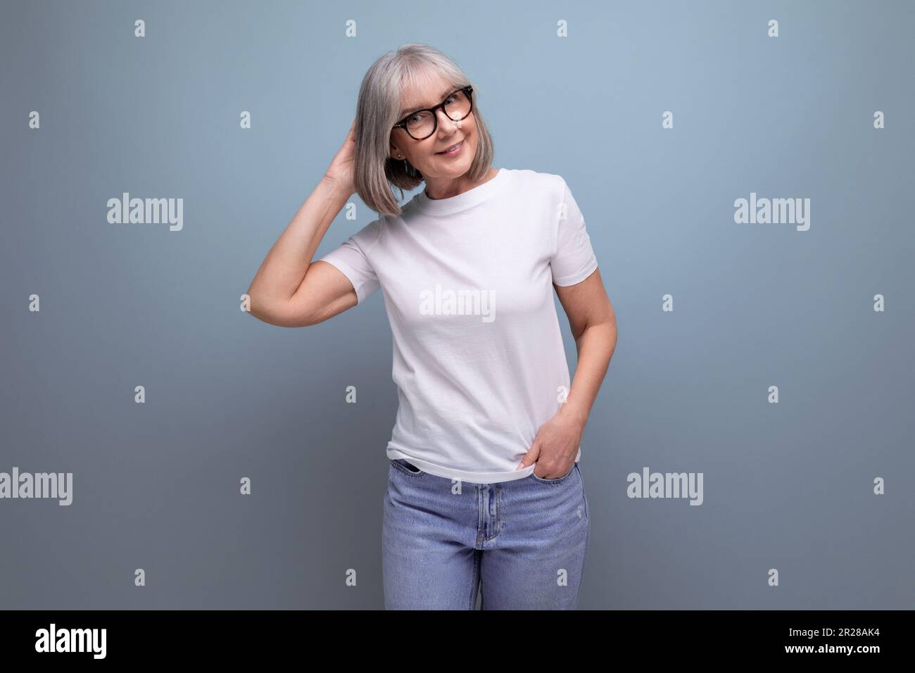 a mature woman of retirement age is in menopause in a white tank top on