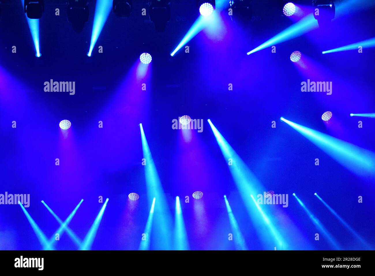 Stage lights glowing in the dark Stock Photo