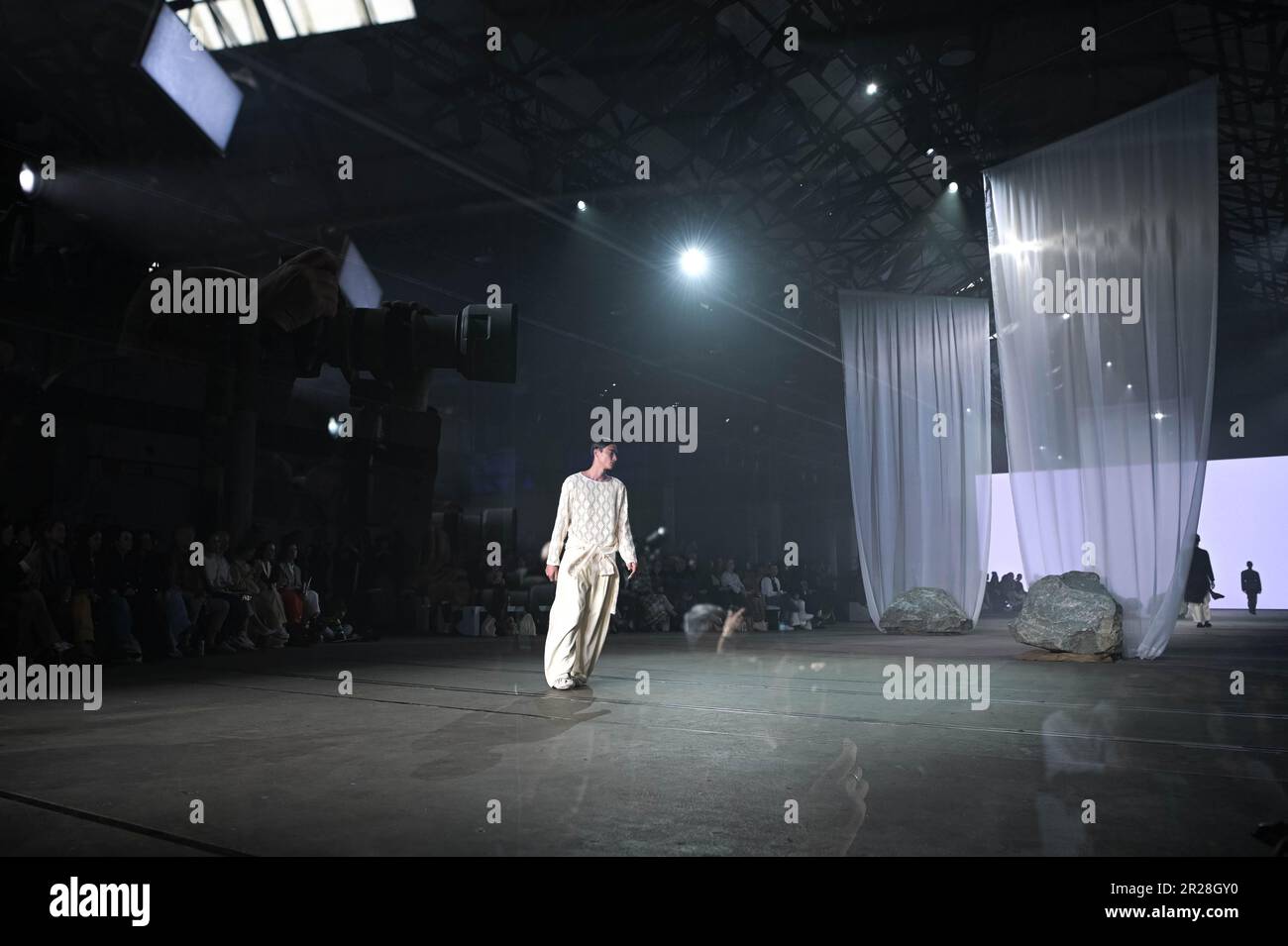 An in-camera multiple exposures of models walking the runway at the ...