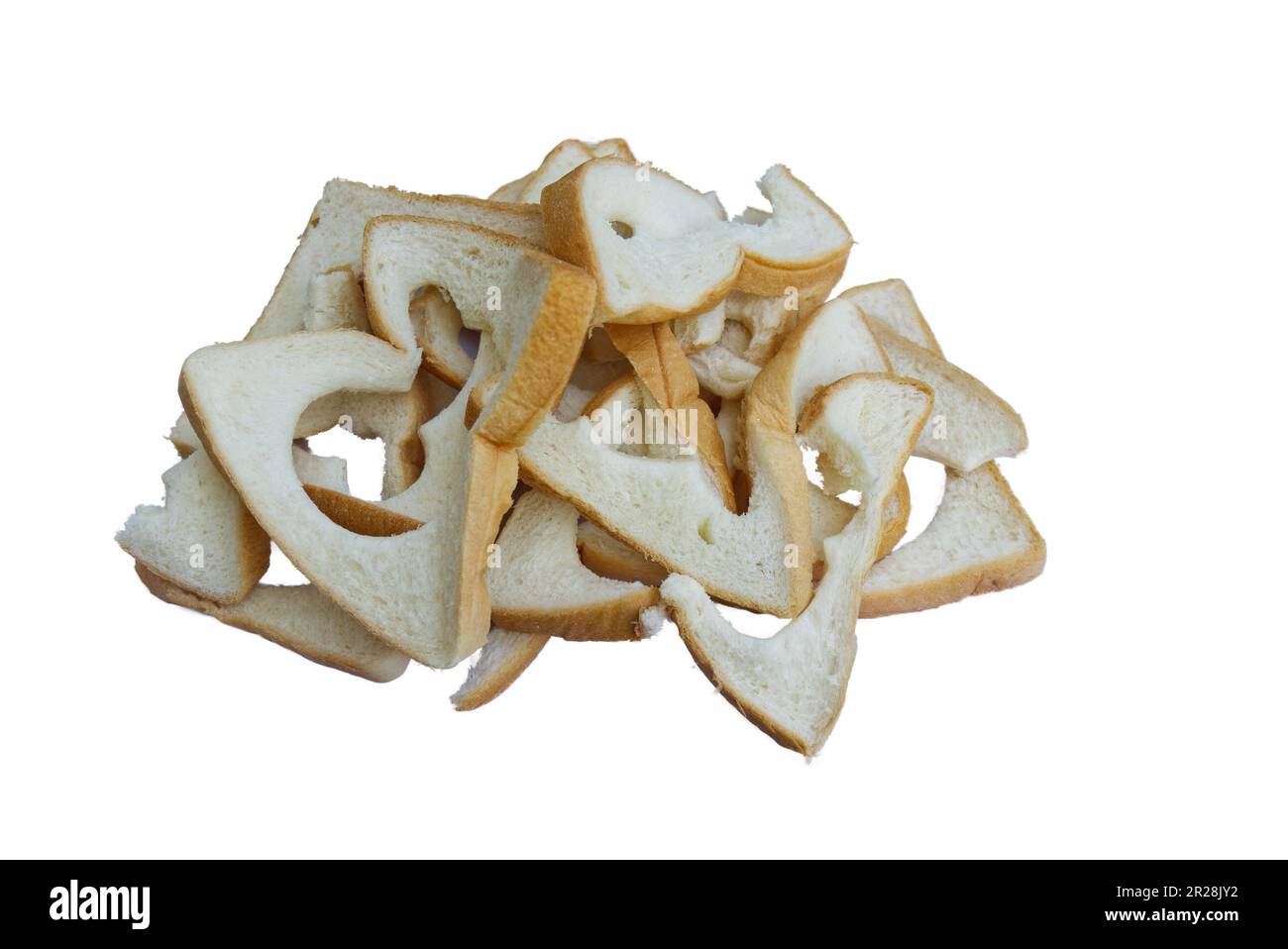 edge of bread crubms white and brown torn isolated white background.wasted food bakery and baked