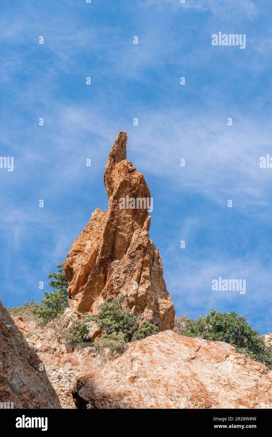 A close up of rocks that look like the beak of a bird or a sharp nose ...