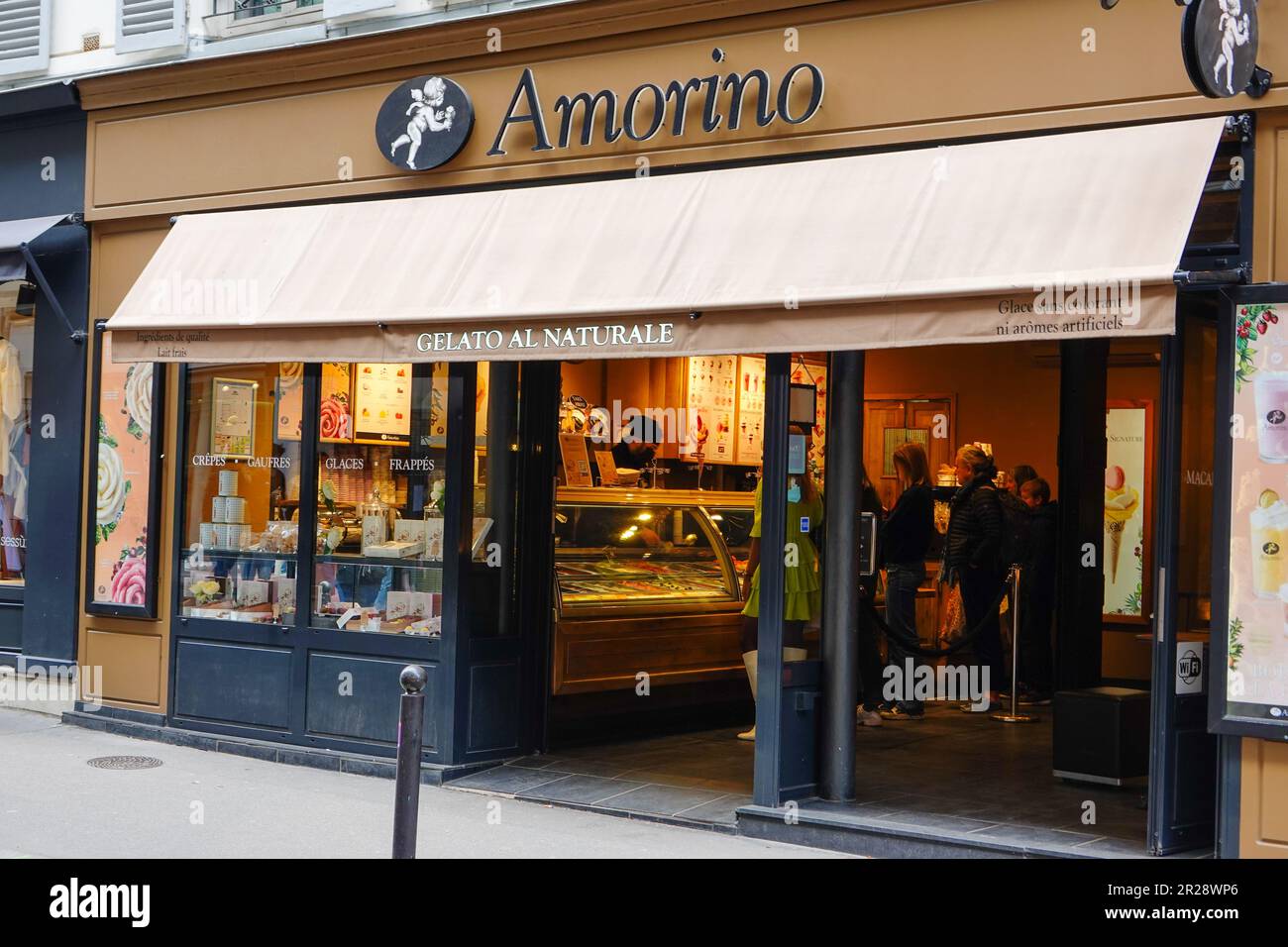 People in the Amorino Vavin, ice cream shop, gelato al naturale, in Paris, France. Stock Photo