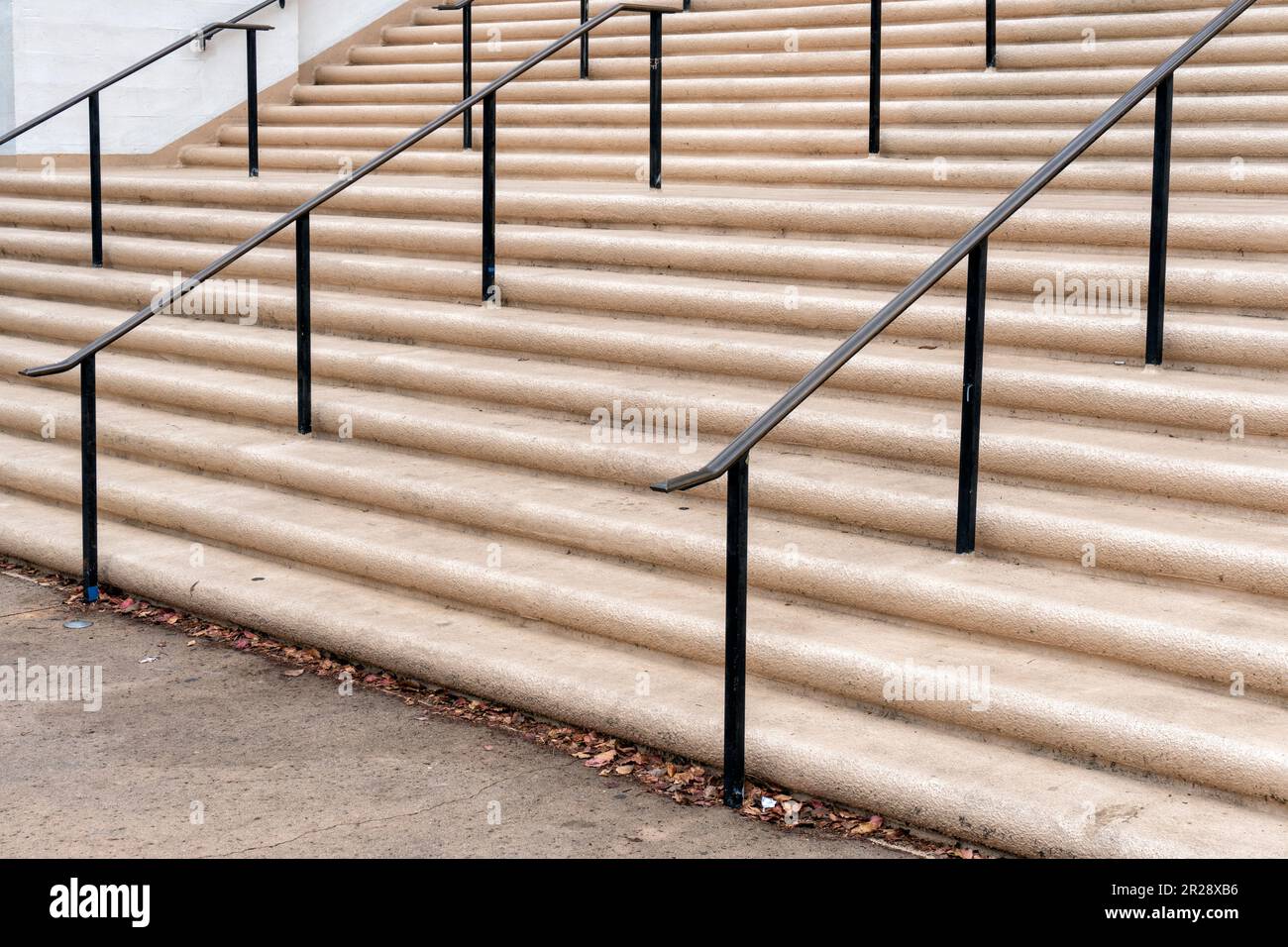 Old concrete staircase with metal handrails Stock Photo