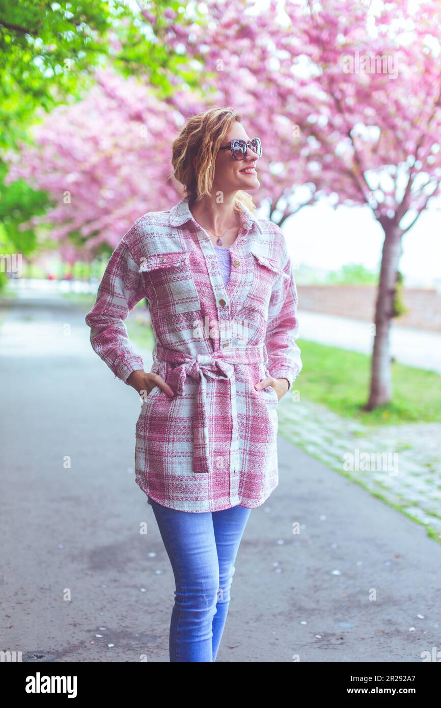 Woman alone walking park happy hi-res stock photography and images - Alamy