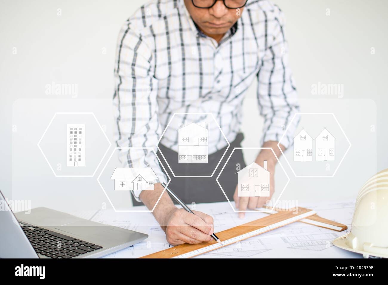 Closeup, Male architect Hold a pencil to design and calculate the