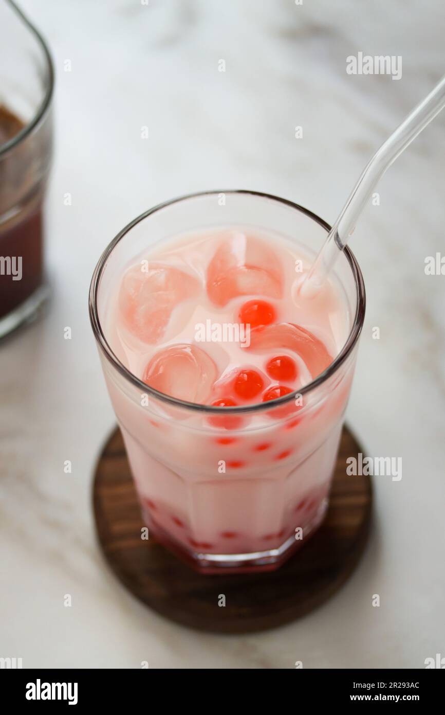Close up of home made milk bubble tea with tapioca pearls. Strawberry