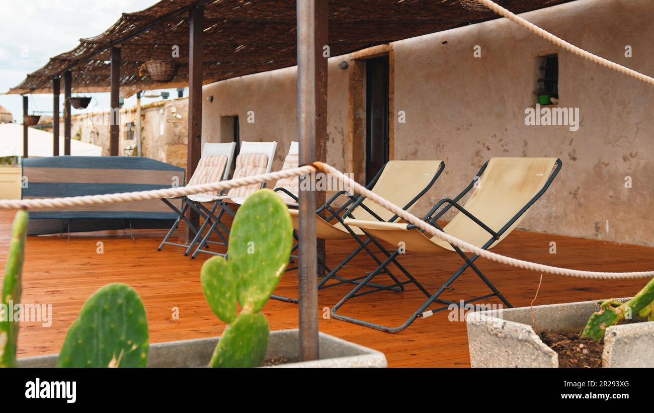 Sea view terrace with deck chairs Stock Photo - Alamy
