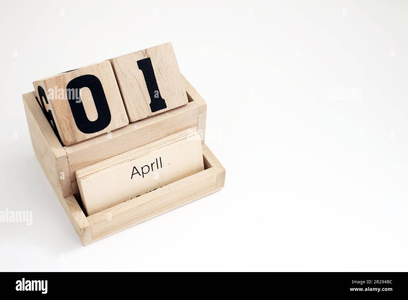 Wooden perpetual calendar showing the 1st of April Stock Photo - Alamy