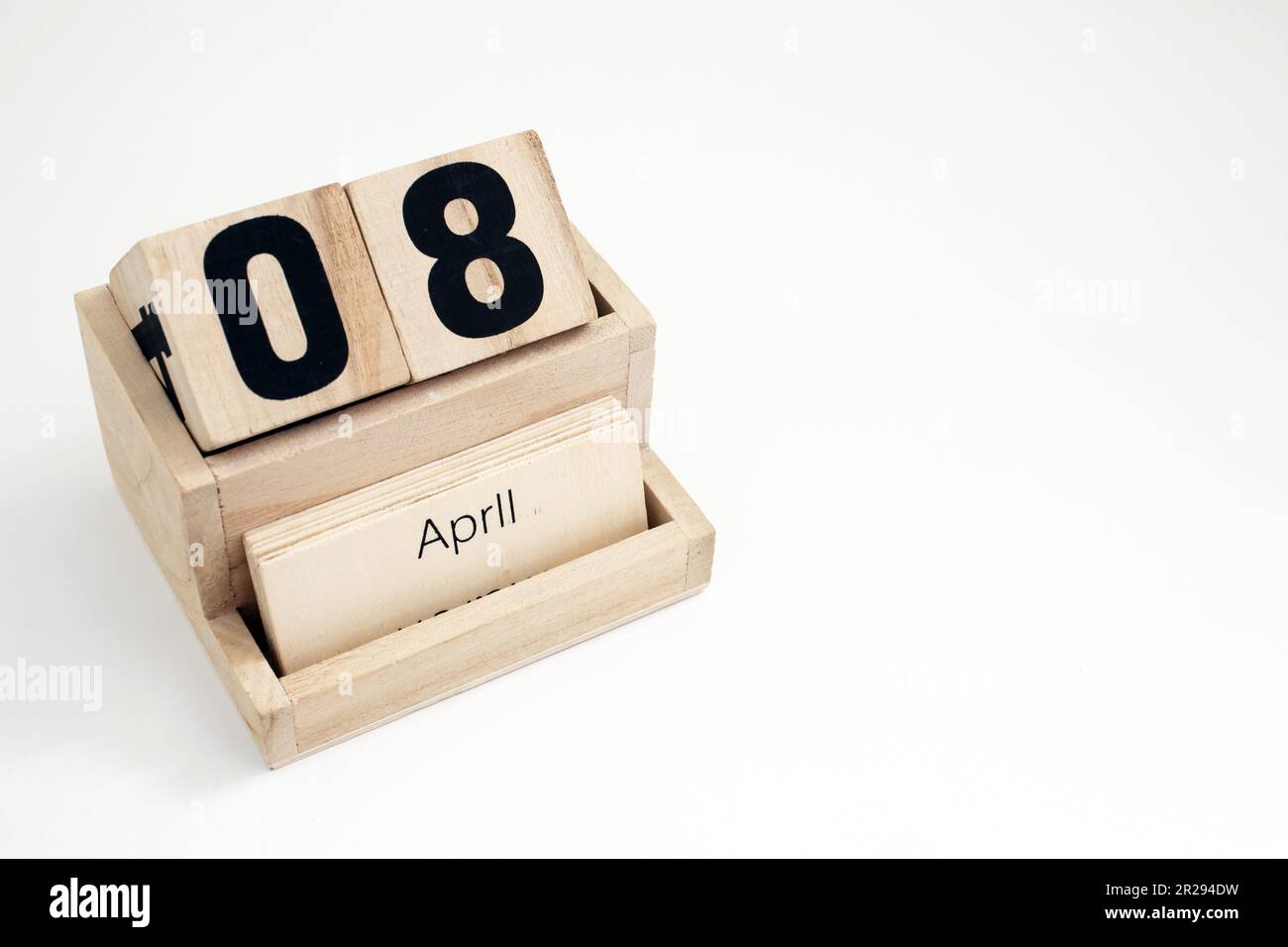 Wooden perpetual calendar showing the 8th of April Stock Photo - Alamy