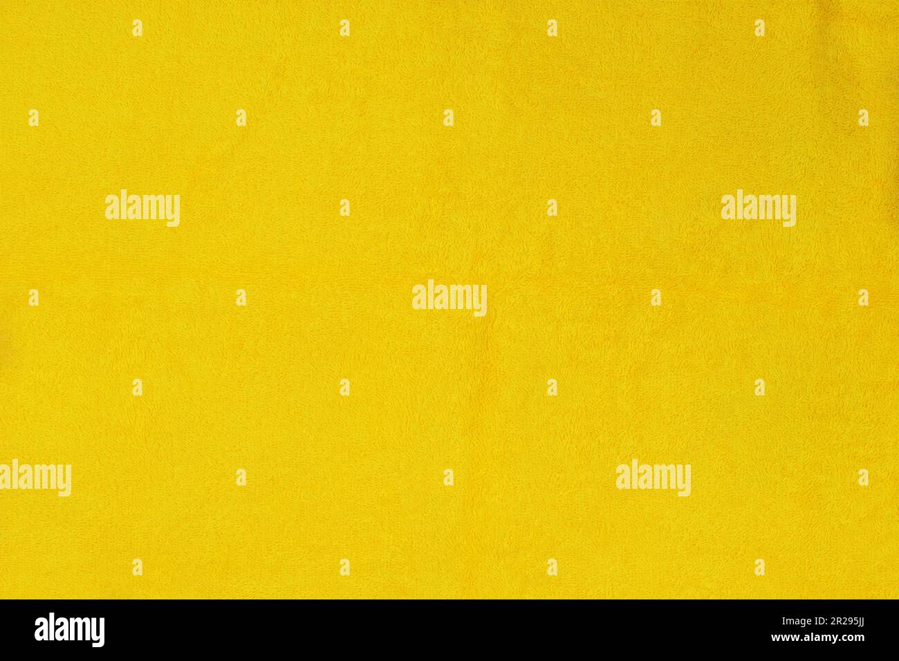 Bath towel background. Cotton towel for sea beach. Yellow color Stock