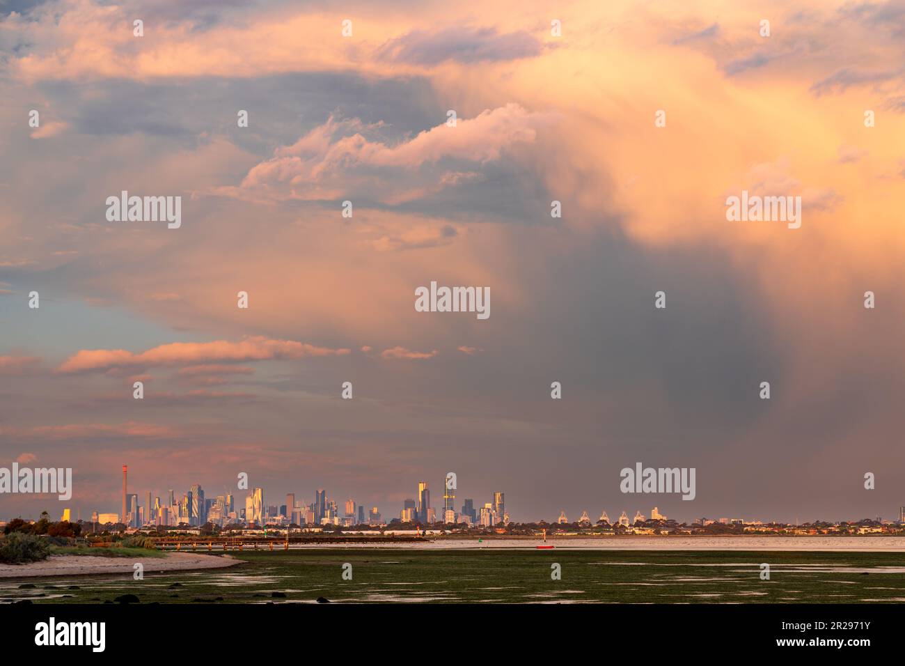 Distant view of a large storm over a City skyline near Altona in
