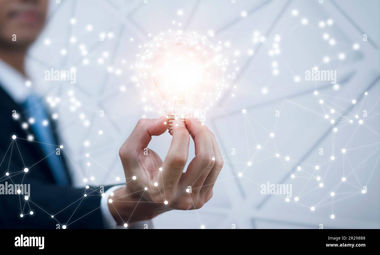 The Man hand holding light bulb with line connect and working on the ...