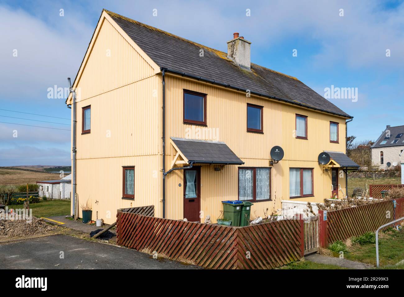 Semi-detached houses at Burravoe in the south of the island of Yell, Shetland. Stock Photo