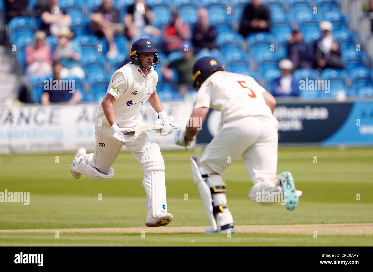 Glamorgan's Billy Root (left) and Kiran Carlson run between the wickets as they bat on day one of the LV= Insurance County Championship match at the 1st Central County Ground, Hove. Picture date: Thursday May 18, 2023. Stock Photo