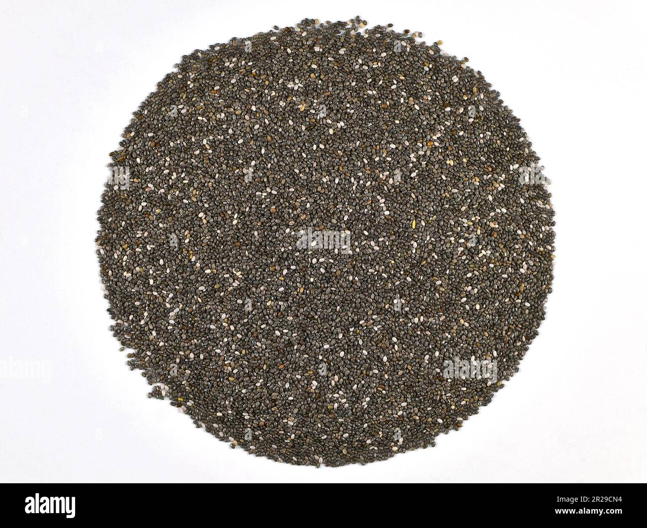 Chia seeds on a plain white background. Health food concept. Stock Photo